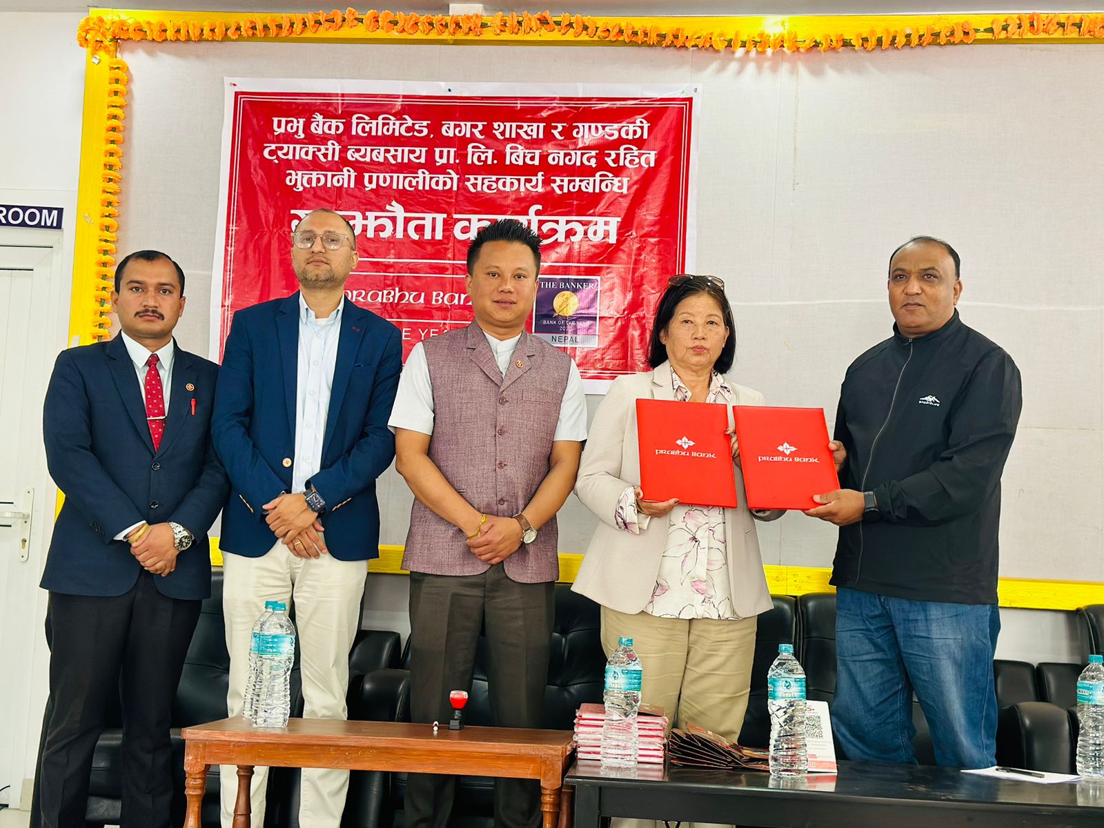 प्रभु बैंक र गण्डकी ट्याक्सी व्यवसाय प्रालीबीच नगदरहित भुक्तानी प्रणालीको सहकार्य